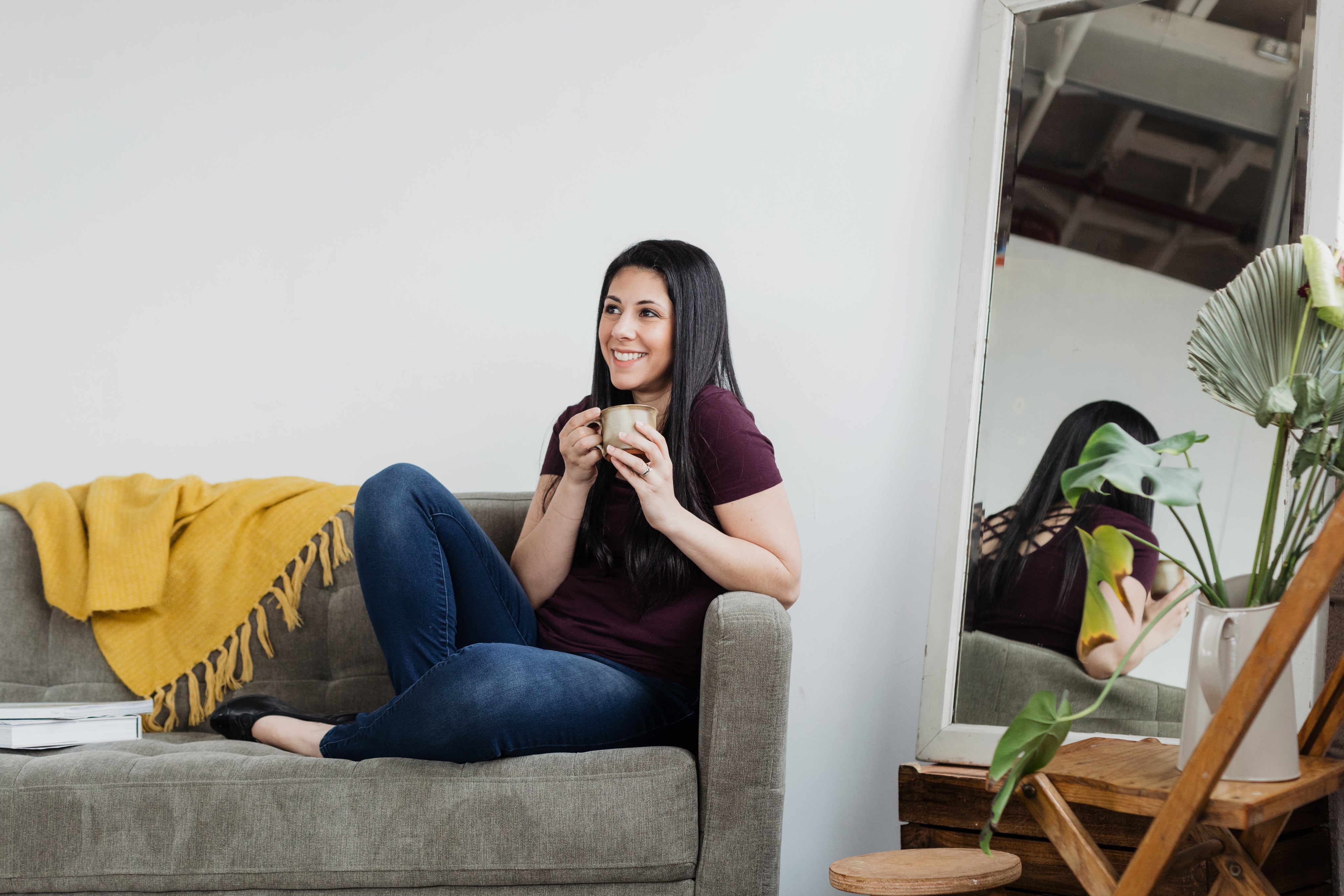 files/woman-cradles-coffee-on-a-sofa.jpg